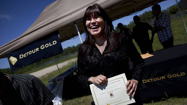 Taykwa Tagamou Chief Linda Job receives a ceremonial share certificate from Detour Gold Corp. as part of a joint venture that will see co-operation between the native community and the mining company. Taykwa Tagamou Chief Linda Job receives a ceremonial share certificate from Detour Gold Corp. as part of a joint venture that will see co-operation between the native community and the mining company.
